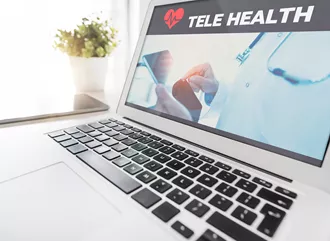 Searching Telehealth on laptop