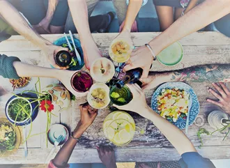 Friends sharing food around a table
