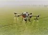 A drone spaying a field of crops