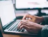 A man researching about R&D on his desk.