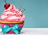 A highly decorated pink cupcake with icing and a cherry on top.