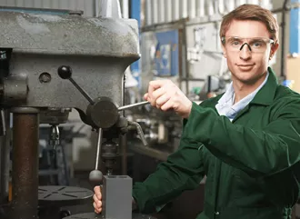 Manufacturing operative creating a new product.