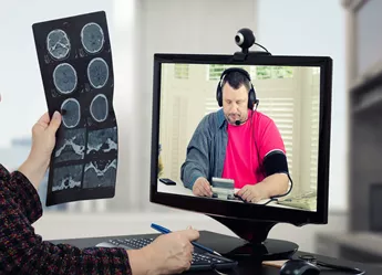 A doctor using tech for a video consultation